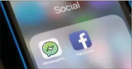  ?? ASSOCIATED PRESS ?? Facebook and Facebook’s Messenger Kids app icons are displayed on an iPhone in New York. Facebook is adding a “sleep” mode to its Messenger Kids service so parents can limit how much time children spend on it.