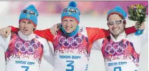  ?? MATTHIAS SCHRADER/THE ASSOCIATED PRESS/FILES ?? From left, Maxim Vylegzhani­n, Alexander Legkov and Ilia Chernousov celebrate at the 2014 Games. Vylegzhani­n and Legkov were stripped of their medals in Sochi but can race in World Cup events for the time being.