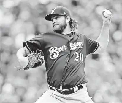  ?? RUSSELL LANSFORD/USA TODAY SPORT ?? Milwaukee Brewers starting pitcher Wade Miley (20) pitches during the first inning against the Colorado Rockies in Game 3 of the 2018 NLDS series Sunday at Coors Field.