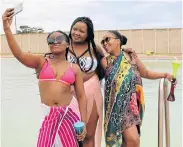  ?? Picture: FREDLIN ADRIAAN ?? BODY POSITIVITY: Embracing their body sizes at the Iz’dudla Pool Party at Zwide Dam on Saturday were, from left, Zandile Ngemntu, Busiswa Nqompoyi and Sithisa Sibidla