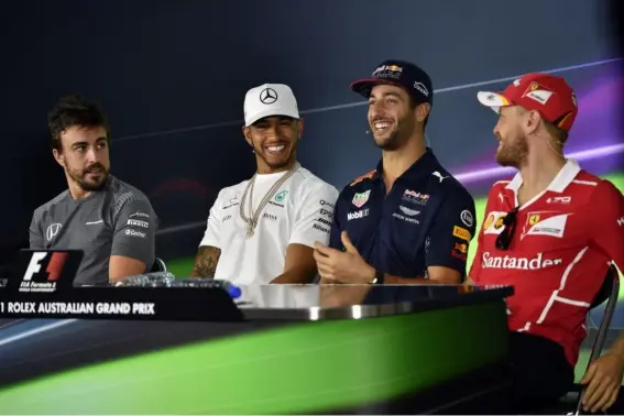  ?? (AFP/Getty Images) ?? Fernando Alonso, Lewis Hamilton, Daniel Ricciardo and Sebatian Vettel are all on the grid in 2017