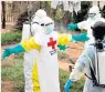  ??  ?? Deadly: a Red Cross burial team responding to a death from Ebola