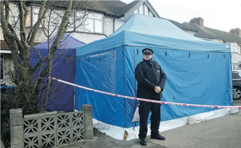  ?? YUI MOK / PA VIA THE ASSOCIATED PRESS ?? A residentia­l house in southwest London is sealed off by British police on Tuesday after Russian businessma­n Nikolai Glushkov, a close friend of Putin critic Boris Berezovsky, was found dead late Monday.