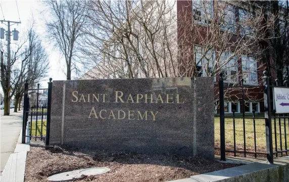  ?? GETTY IMAGES ?? SCHOOL’S OUT: St. Raphael Academy in Pawtucket, R.I., has been closed for sanitizati­on after a case of coronaviru­s was confirmed there. Above right, a cafeteria at the school sits vacant.