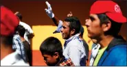  ?? AP/REBECCA BLACKWELL ?? Central American migrants march Thursday to a United Nations human-rights office in Mexico City to make their case for buses to carry them to the U.S. border.