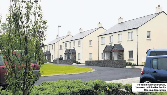  ??  ?? > Social housing on Gower, Swansea, built by the Family Housing Associatio­n