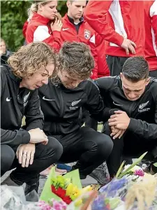  ?? GETTY, ALDEN WILLIAMS/STUFF ?? Christchur­ch Muslims at prayer the week after the shootings, and Canterbury football players mourning the death of New Zealand futsal goalkeeper Atta Elyyan, who was killed at the Masjid Al Noor.