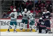  ?? JESS RAPFOGEL — THE ASSOCIATED PRESS ?? San Jose Sharks left wing Evgeny Svechnikov (10) celebrates with left wing Jonah Gadjovich (42) and center Logan Couture (39) after scoring against the Washington Capitals during the first period of a game on Sunday, in Washington.