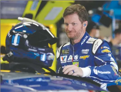  ?? The Associated Press ?? WINNING MENTALITY: Dale Earnhardt Jr. prepares to practice for a NASCAR Cup Series auto race Thursday in Concord, N.C. The 42-year-old Earnhardt seeks his first Cup Series points race victory at Charlotte Motor Speedway in today’s Coca-Cola 600.