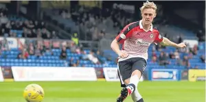  ??  ?? Going down with Hearts will stand Kevin McHattie in good stead.