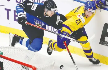  ?? FILES ?? Sweden's Nils Hoglander, right — seen during the bronze-medal match between Finland and Sweden at the world juniors in the Czech Republic in January — is on loan to the Swedish Hockey League, where the Canucks prospect has three goals, seven assists and a tidy plus-5 rating this season.