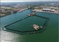  ??  ?? Bermingham drove steel walls into the bottom of Randle Reef that will be used to encapsulat­e a giant blob of contaminat­ed material.