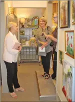  ??  ?? Artist Karen Jordan, left, chats with Debbie O’Connor and Bess Bosworth during the Arts Girls event. Jordan brought 25 of her oil on canvas pieces to the show. Her florals and sheep paintings seemed to be extremely popular with visitors.