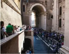  ??  ?? Lines leaving the Vatican Museum wind down, around and toward the entrance to St. Peter’s Cathedral.