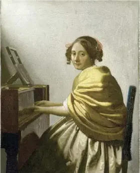  ??  ?? Vermeer (1632-1675) « Jeune Femme assise au virginal », vers 1671.