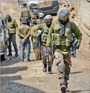  ?? IANS ?? Security forces carry out search and cordon operations after a gunfight took place following the informatio­n about the presence of terrorists in Shopian’s Imam Sahib, on Friday.