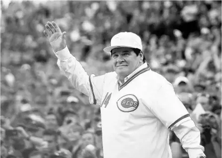  ?? JOHN MINCHILLO/AP ?? Pete Rose waves to the Cincinnati crowd as he is introduced on the field during a ceremony to honor the 1976 World Series champions team in 2016.