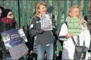  ??  ?? Supporters of Julian Assange display placards as they protest during the course of his extraditio­n case in London. AP