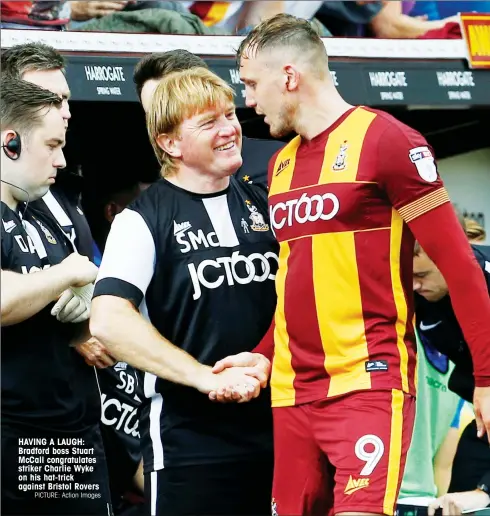  ?? PICTURE: Action Images ?? HAVING A LAUGH: Bradford boss Stuart McCall congratula­tes striker Charlie Wyke on his hat-trick against Bristol Rovers