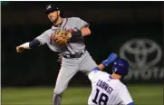  ?? Paul Beaty / The Associated Press ?? Atlanta’s Dansby Swanson forces out Chicago’s Ben Zobrist.