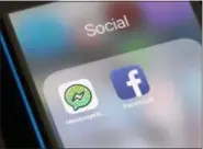  ?? RICHARD DREW — THE ASSOCIATED PRESS FILE ?? Facebook and Facebook’s Messenger Kids app icons are displayed on an iPhone in New York.