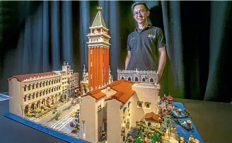  ?? JOHN KIRKANDERS­ON/ STUFF ?? Lego expert and master builder Centuri Chan with his St Mark’s Square model.