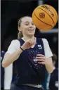  ?? ERIC GAY — THE ASSOCIATED PRESS ?? UConn's Paige Bueckers smiles during a practice session on Saturday in Minneapoli­s.