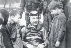  ?? PICTURE: GETTY ?? Naval expert and frogman Lionel ‘Buster’ Crabb chats to Tobermory children in 1950; he vanished on this day in 1956