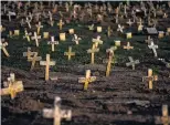  ?? PHOTOS: GETTY IMAGES ?? Loss on a huge scale . . . The Caju cemetery in Rio de Janeiro is filled with Covid19 victims as the official death toll from the pandemic in Brazil passes 360,000.