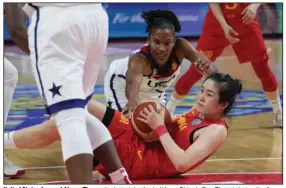  ?? (AP/Mark Baker) ?? United States forward Alyssa Thomas looks to take the ball from China’s Pan Zhenqi during the Americans’ 77-63 victory on Saturday at the FIBA Women’s Basketball World Cup in Sydney, Australia. Thomas scored 12 points on 50% shooting to help the U.S. to its 25th consecutiv­e World Cup victory.