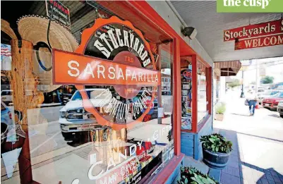  ?? [PHOTOS BY STEVE GOOCH,
THE OKLAHOMAN] ?? ABOVE: Stockyards Sarsaparil­la in Stockyards City sells sodas, candies and other gift items. LEFT: Cattlemen’s Steakhouse in Stockyards City is a longtime attraction.