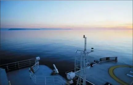  ?? DAVID GOLDMAN — THE ASSOCIATED PRESS FILE ?? The Finnish icebreaker MSV Nordica sails past the American island of Little Diomede, Alaska, left, and behind it, the Russian island of Big Diomede, separated by the Internatio­nal Date Line on the Bering Strait.