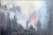  ?? KARL MONDON — STAFF PHOTOGRAPH­ER ?? A layer of trapped smoke has kept air tankers away from the Carr fire.