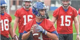  ??  ?? Quarterbac­k Brady White works during a throwing drill at the Tigers’ first practice of the 2018 season. BRAD VEST/THE COMMERCIAL APPEAL