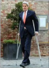  ?? RoNAlD ZAK — tHe ASSoCiAteD PReSS ?? U.S. Secretary of State John Kerry uses crutches as he arrives to address the media in front of Palais Coburg where closed‑door nuclear talks with iran are taking place in Vienna, Austria, thursday.