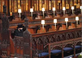  ?? (AP/Jonathan Brady) ?? Queen Elizabeth II sits alone Saturday in St. George’s Chapel at Windsor Castle in Windsor, England, during the funeral of Prince Philip, her husband of 73 years.