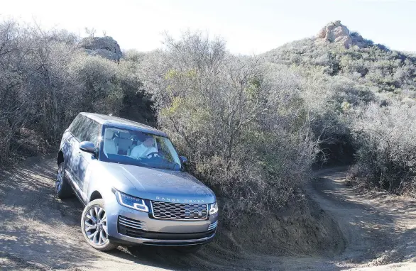  ?? ANDREW McCREDIE ?? It’s a plug-in hybrid, but don’t think the 2018 P400e lacks the Range Rover off-roading DNA. In fact, the battery system and its massive torque are a boon for getting dirty.