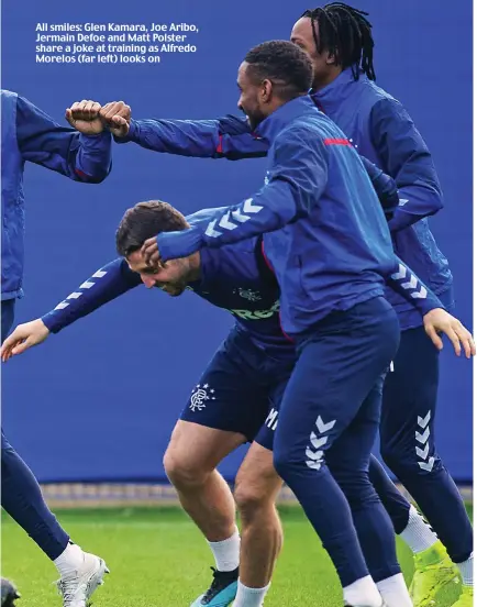  ??  ?? All smiles: Glen Kamara, Joe Aribo, Jermain Defoe and Matt Polster share a joke at training as Alfredo Morelos (far left) looks on