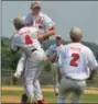  ?? BARRY TAGLIEBER - FOR DFM ?? Spring City’s Cam Michaud is hoisted up into the air by teammate Jacob Mathew after striking out the last batter to end the American Legion Baseball Region 3 title game.