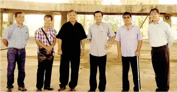  ??  ?? Archbishop Wong (third right) during his site visit to the church building under constructi­on on Wednesday with (from right) Dr Tan, Stephen, Msgr Primus, Dominic and Geoffrey from Stella Maris Church.