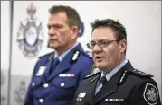  ?? RICK RYCROFT / AP ?? Michael Phelan (right), deputy commission­er of the Australian Federal Police, and David Hudson, deputy commission­er of the New South Wales state police, describe the terror plot Friday in Sydney.
