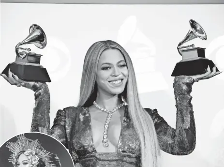  ?? DAN MACMEDAN, USA TODAY ?? Beyoncé poses with her awards during the 59th Grammys, yet the album of the year honor has eluded her despite the singer’s and Lemonade’s cultural impact.