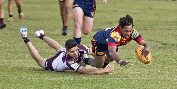  ?? Photos: Nev Madsen ?? TRY TIME: Western Mustangs centre Richard Murray dives over to score a try and give his side the lead against the Burleigh Bears at Gold Park on Saturday. The Bears went on to win 58-10.