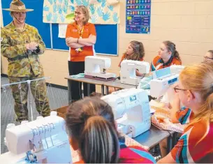  ?? Commanding officer of 3rd Combat Engineer Regiment Lieutenant Colonel Jen Harris speaks to students from Kirwan State High School. ??