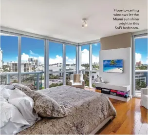  ??  ?? Floor-to-ceiling windows let the Miami sun shine bright in this Sofi bedroom.