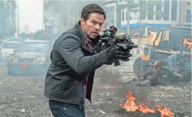  ?? STXFILMS ?? CIA unit leader Mark Wahlberg takes aim in “Mile 22.”