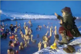  ?? EGILL BJARNASON — THE ASSOCIATED PRESS ?? Local actor playing ‘Candel-Stealer’, one of Iceland’s 13 mischievou­s troll brothers that have taken the role of Father Christmas, addresses guests at the geothermal nature lagoon by Lake Myvatn, north Iceland, Saturday.