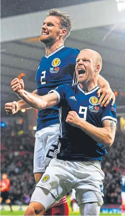  ?? Picture: SNS Group. ?? Steven Naismith celebrates with Stephen O’Donnell after the striker’s header was deflected into the net to open the scoring.