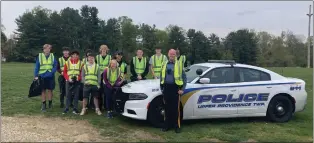  ?? ?? Upper Providence Township Cpl. Gary Essaf and the cleanup crew after their work Sunday along Route 252in the township for an Earth Day project.