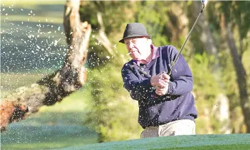  ??  ?? Nar Nar Goon’s Don Towan plays out of the bunker and onto the green during his round at Garfield.